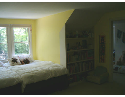 135 Red Gate Lane Amherst, MA 01002 - Photo 13 of 15 a bed sitting in a bedroom next to a window