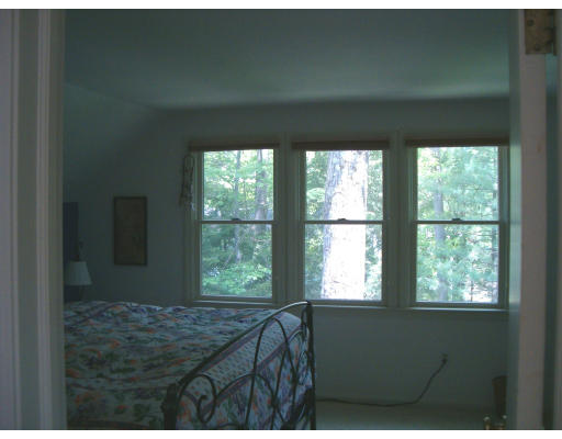 135 Red Gate Lane Amherst, MA 01002 - Photo 14 of 15 a bed sitting in a bedroom next to a window