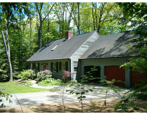 135 Red Gate Lane Amherst, MA 01002 - Photo 2 of 15 a front view of house with yard and trees in the background
