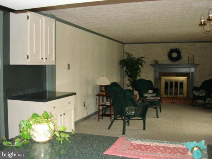3116 Newcastle Lane Riva, MD 21140 - Photo 12 of 23 a living room with furniture and a fireplace