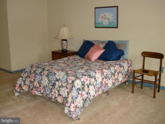 3116 Newcastle Lane Riva, MD 21140 - Photo 13 of 23 a bedroom with a bed and a chair