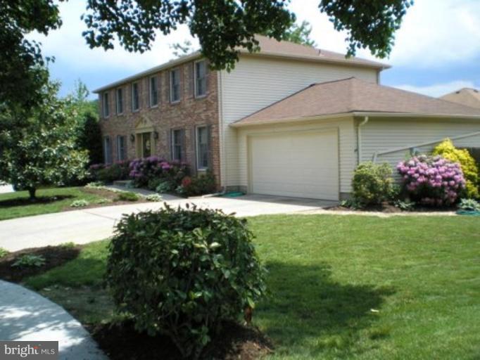 3116 Newcastle Lane Riva, MD 21140 - Photo 3 of 23 a front view of a house with a garden and yard