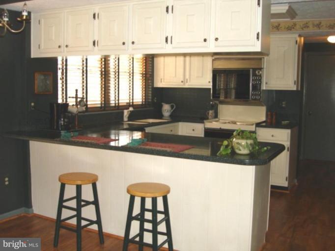 3116 Newcastle Lane Riva, MD 21140 - Photo 23 of 23 a kitchen with stainless steel appliances granite countertop a sink and a refrigerator
