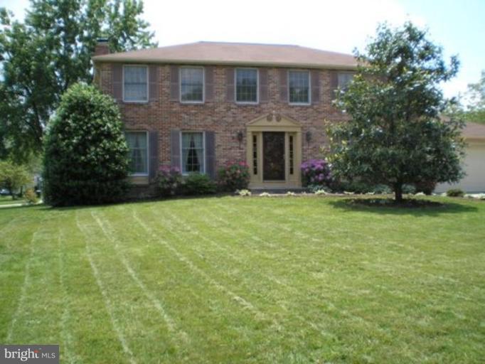 3116 Newcastle Lane Riva, MD 21140 - Photo 4 of 23 a front view of a house with a yard and trees