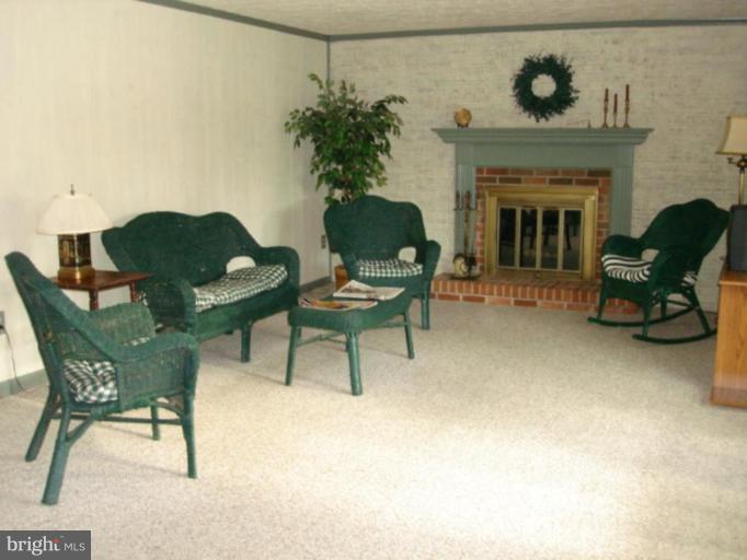 3116 Newcastle Lane Riva, MD 21140 - Photo 8 of 23 a living room with furniture and a fireplace