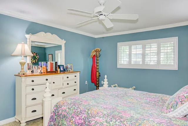 a bedroom with a bed and a dresser