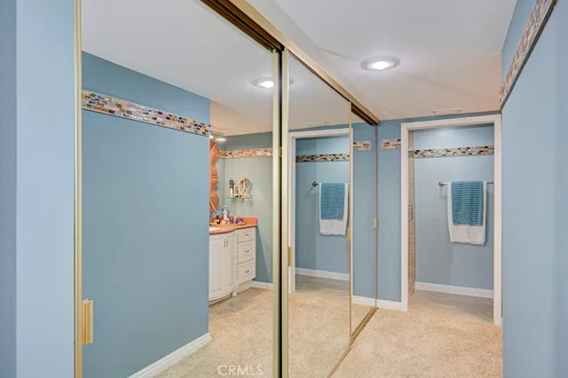 a bathroom with a glass shower door