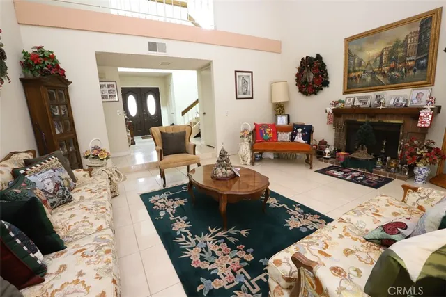 a bedroom with furniture or couch and a flat screen tv