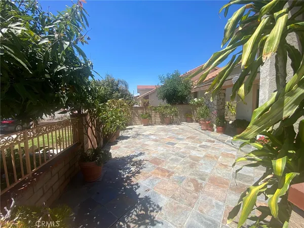 a spacious bedroom with a bed and a table in it