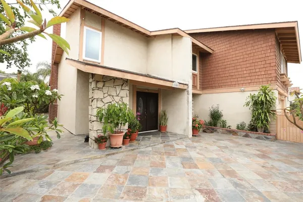 a kitchen with a stove top oven cabinets and a refrigerator