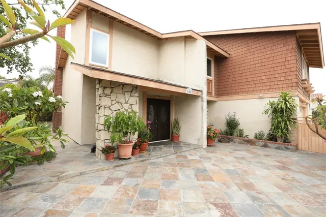 a kitchen with a stove top oven cabinets and a refrigerator