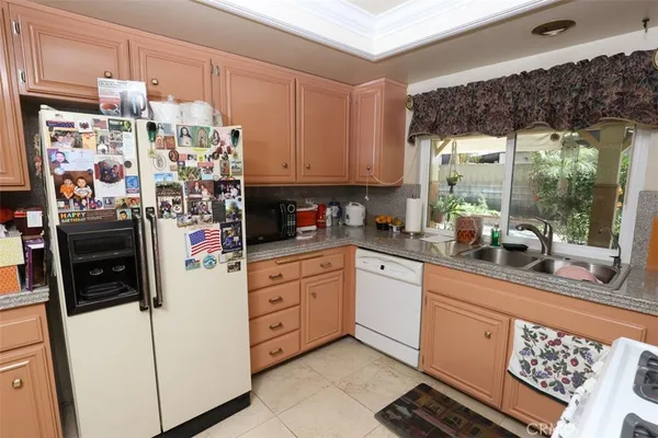 a kitchen with a stove top oven sink and cabinets