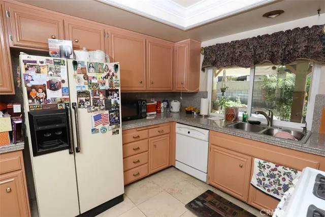 a kitchen with a stove top oven sink and cabinets