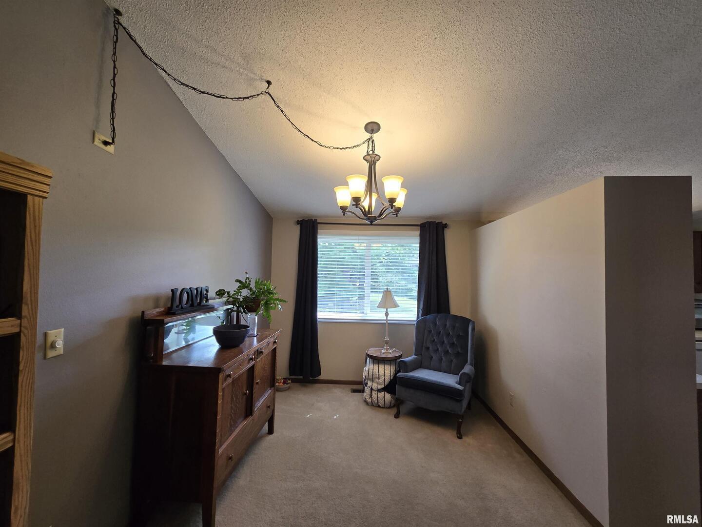 7955 Sugar Grove Road Rushville, IL 62681 - Photo 11 of 28 a living room with furniture and a window