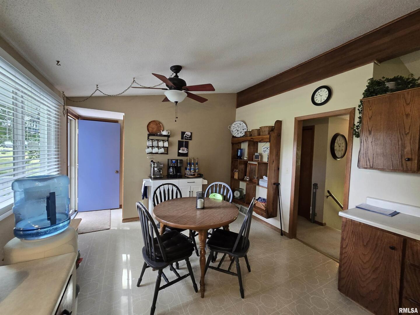 7955 Sugar Grove Road Rushville, IL 62681 - Photo 15 of 28 a dining room with furniture and window