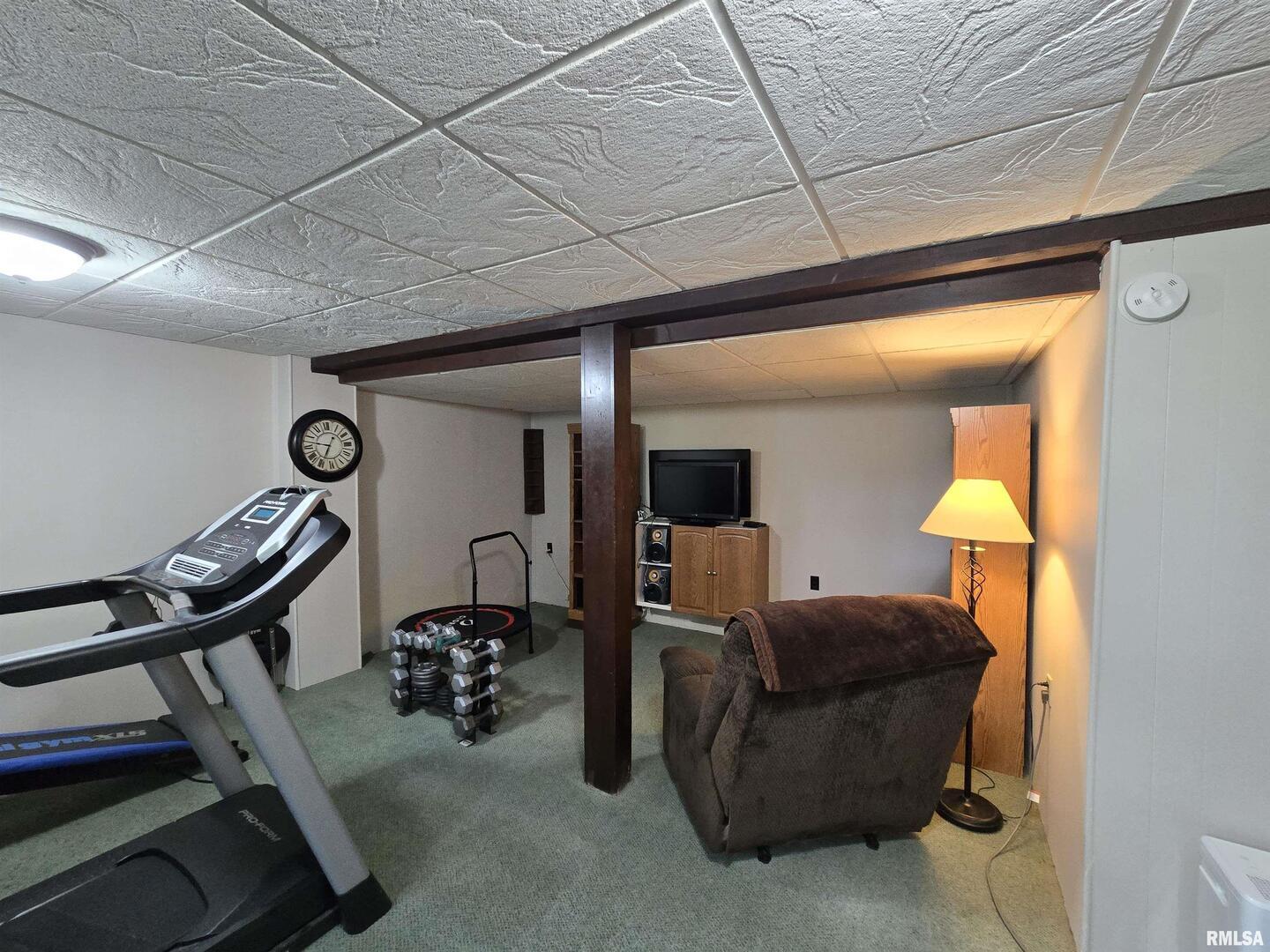 7955 Sugar Grove Road Rushville, IL 62681 - Photo 24 of 28 a living room with furniture and a chandelier