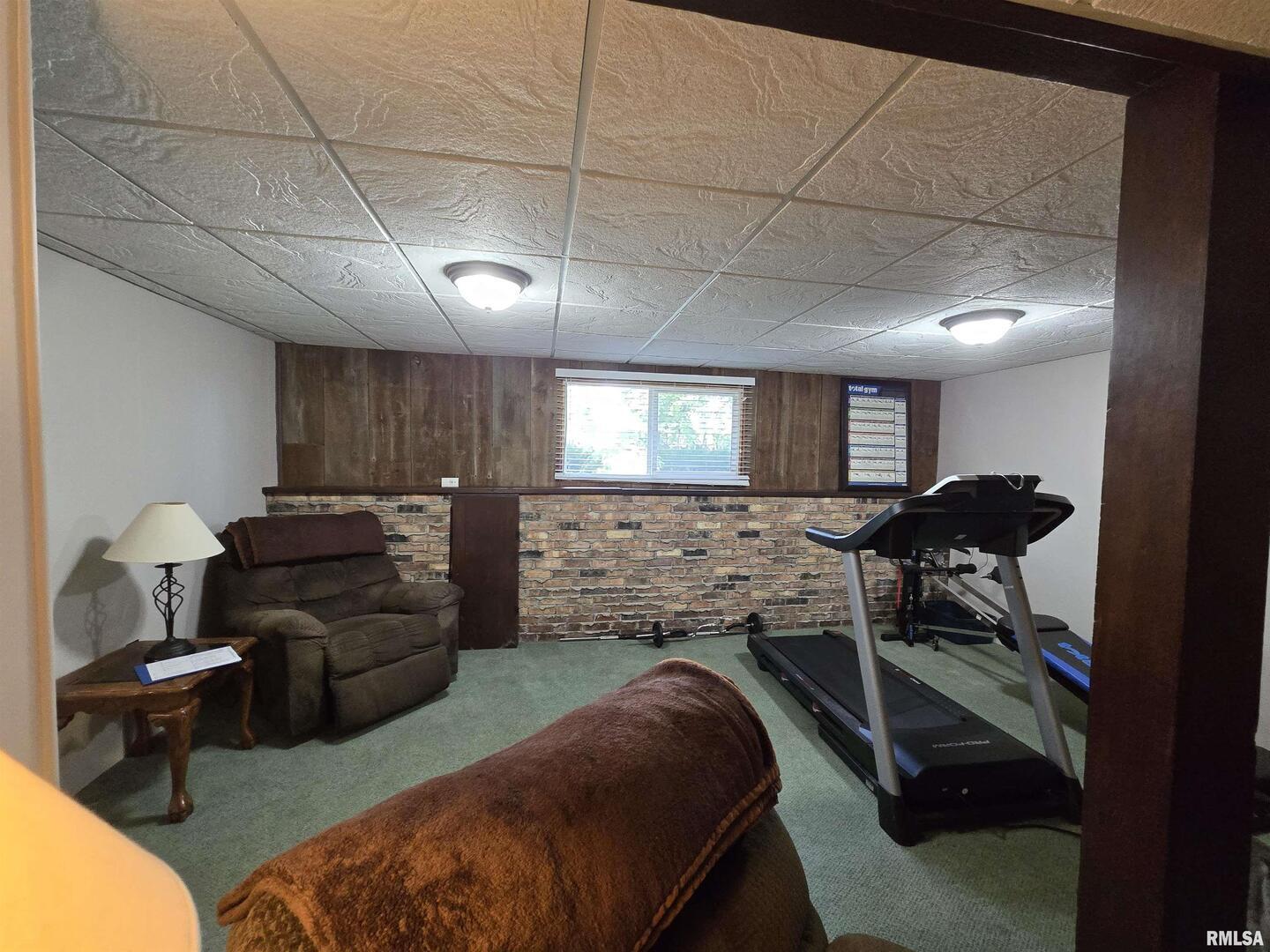 7955 Sugar Grove Road Rushville, IL 62681 - Photo 25 of 28 a living room with furniture and a flat screen tv