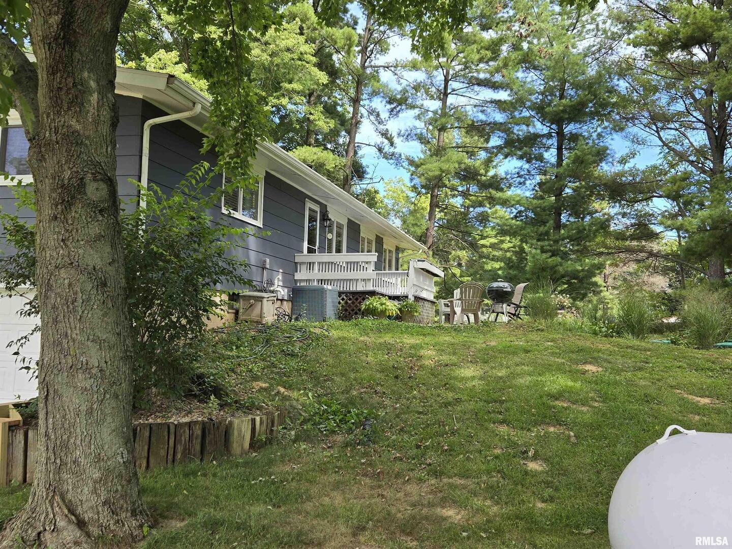 7955 Sugar Grove Road Rushville, IL 62681 - Photo 7 of 28 a house view with a garden space
