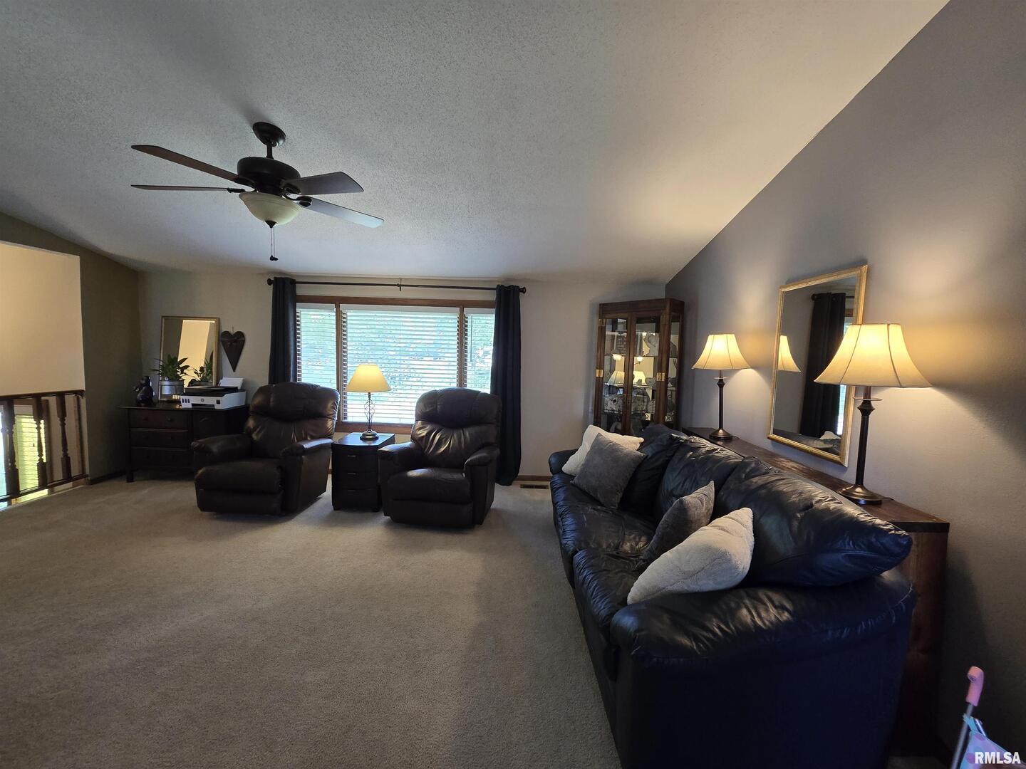 7955 Sugar Grove Road Rushville, IL 62681 - Photo 10 of 28 a living room with furniture and a ceiling fan