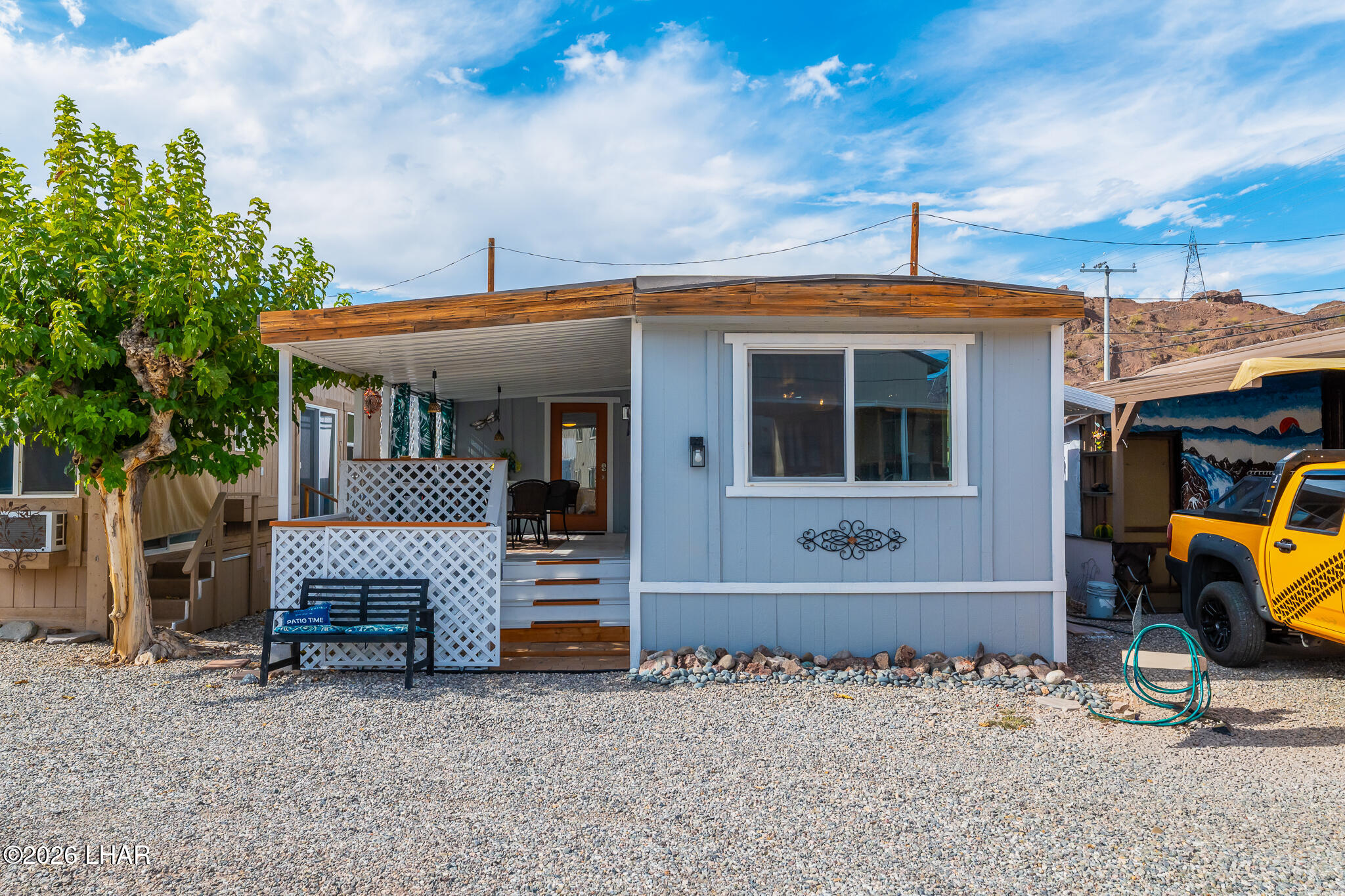 3170 Parker Dam Road, Unit 8 Parker, AZ 85344 - Photo 43 of 53 a front view of a house with patio