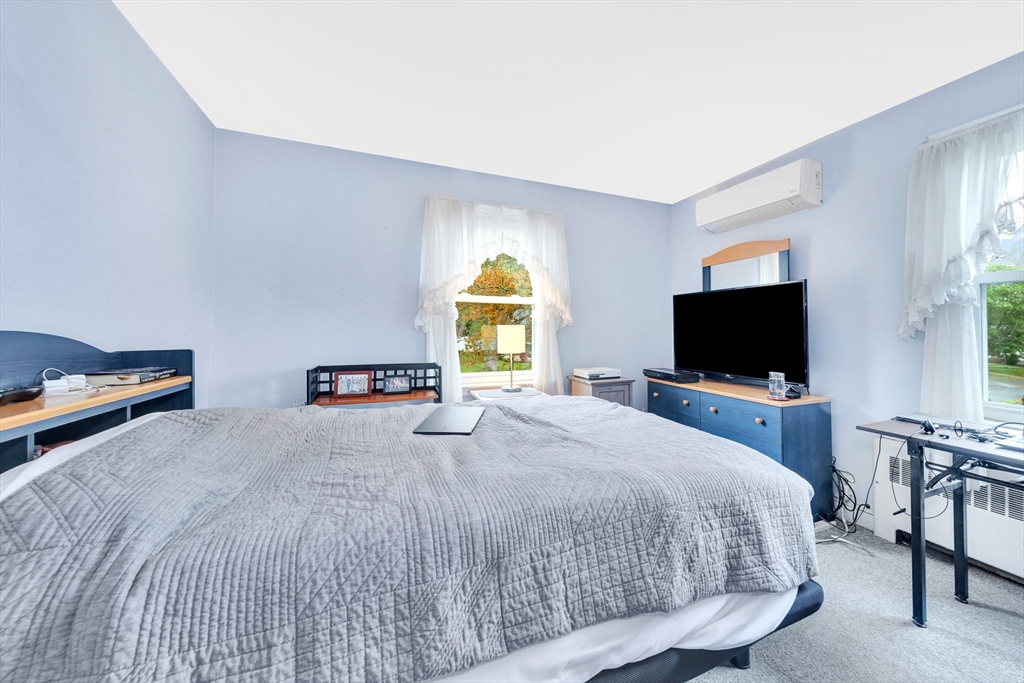 25 Kevin Road Milton, MA 02186 - Photo 12 of 39 a bedroom with a bed and a flat screen tv