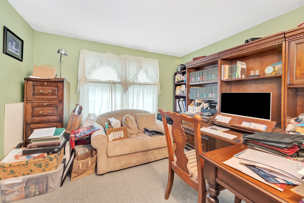 25 Kevin Road Milton, MA 02186 - Photo 14 of 39 a bedroom with furniture and a flat screen tv