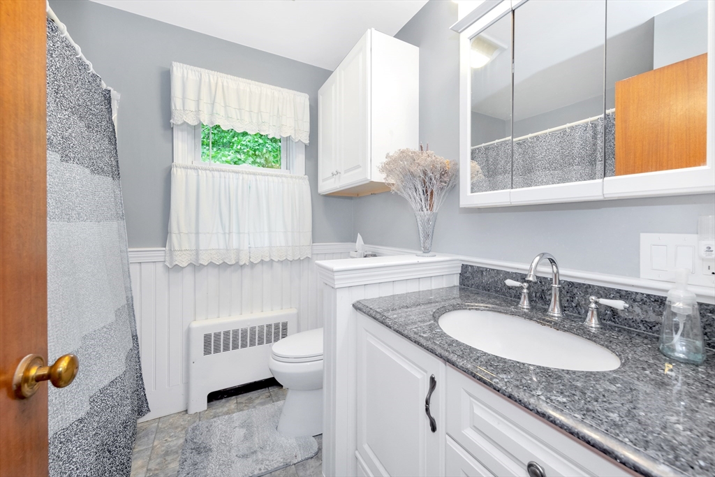 25 Kevin Road Milton, MA 02186 - Photo 15 of 39 a bathroom with a sink and a mirror