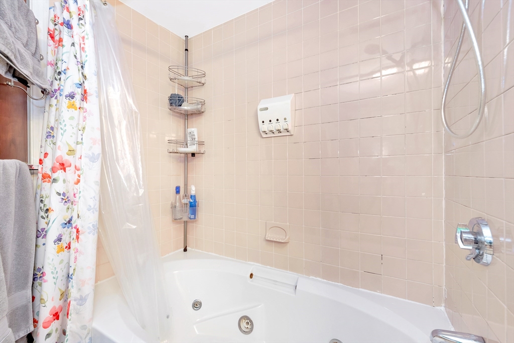 25 Kevin Road Milton, MA 02186 - Photo 20 of 39 a bathroom with a bathtub and shower