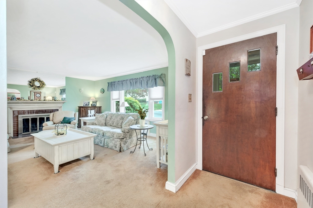 25 Kevin Road Milton, MA 02186 - Photo 21 of 39 a living room with furniture and a fireplace