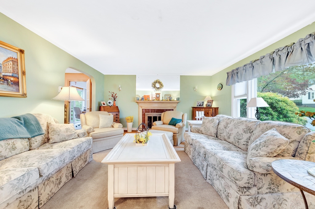 25 Kevin Road Milton, MA 02186 - Photo 23 of 39 a living room with furniture and a fireplace