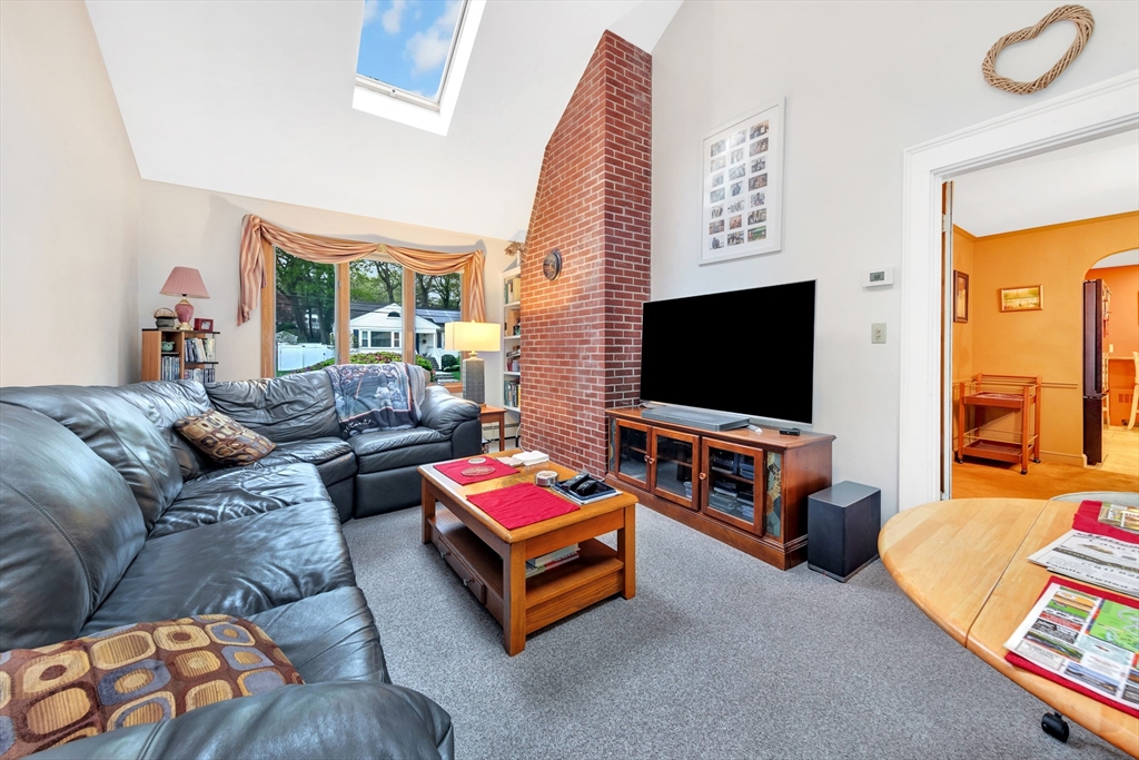 25 Kevin Road Milton, MA 02186 - Photo 30 of 39 a living room with furniture and a flat screen tv