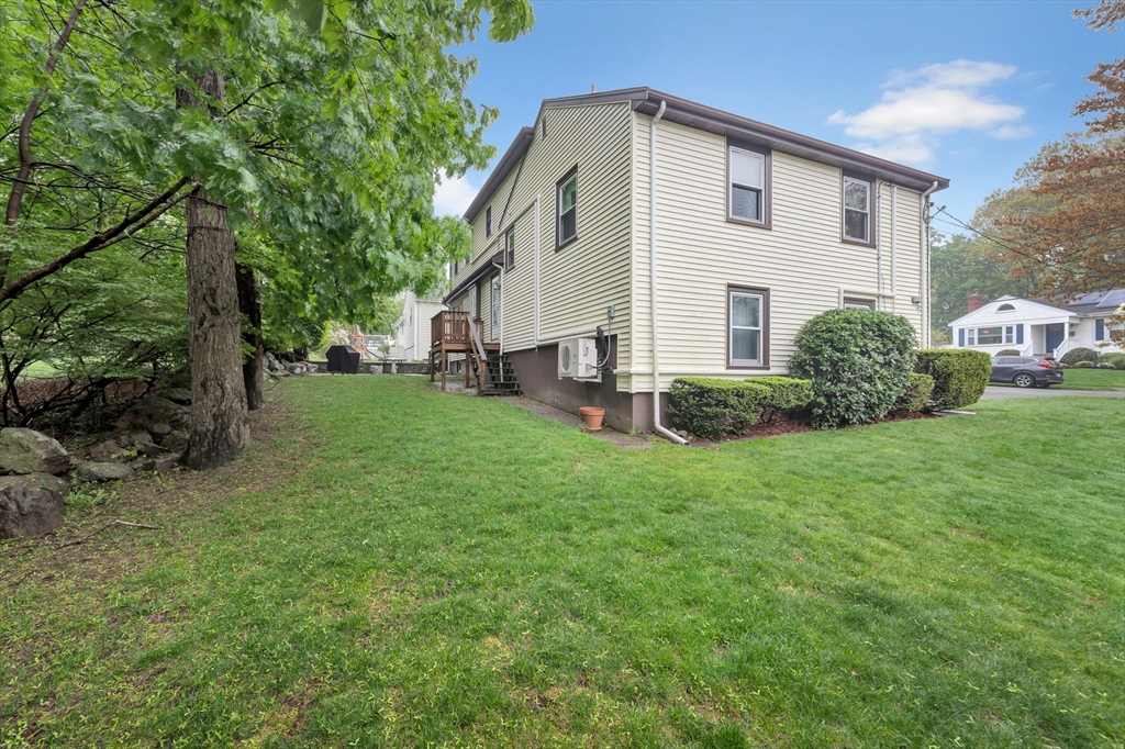 25 Kevin Road Milton, MA 02186 - Photo 6 of 39 a front view of a house with a garden