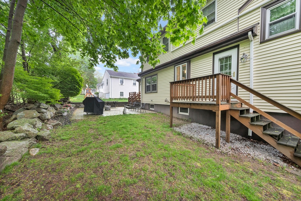 25 Kevin Road Milton, MA 02186 - Photo 7 of 39 a backyard of a house with seating space