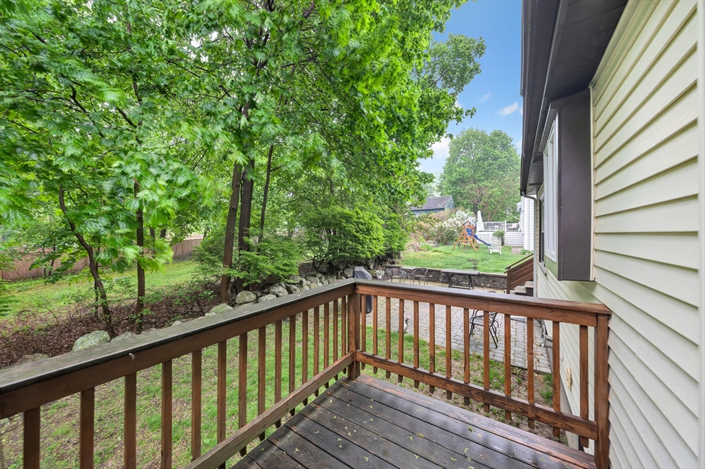 25 Kevin Road Milton, MA 02186 - Photo 8 of 39 a view of a wooden deck next to a yard