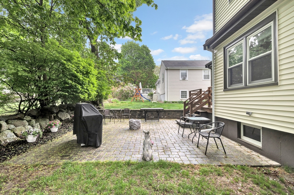 25 Kevin Road Milton, MA 02186 - Photo 9 of 39 a view of house with backyard and outdoor seating