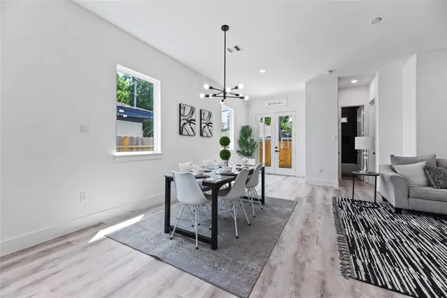 a living room with furniture and kitchen view