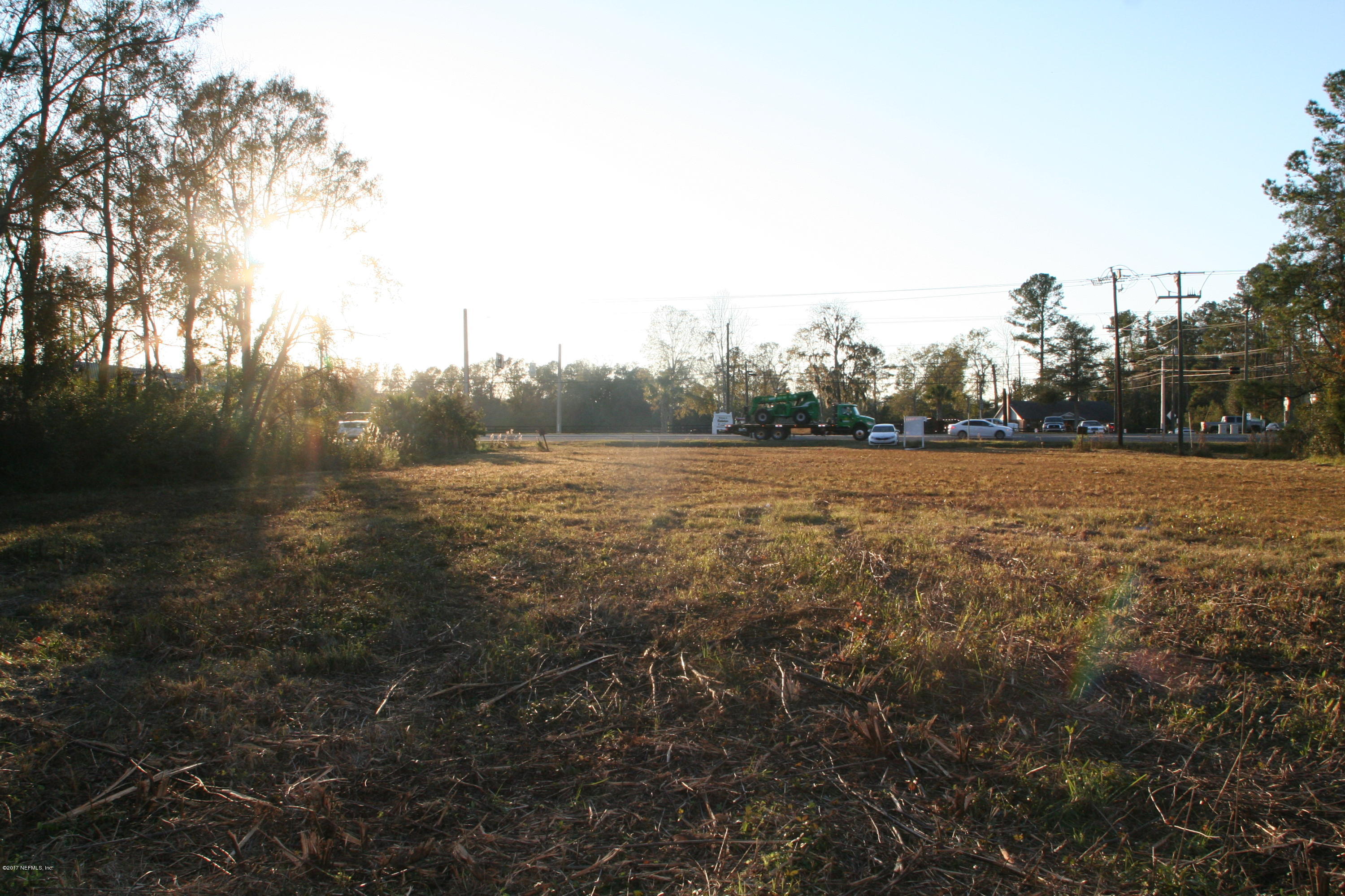 542640 Highway 1 Callahan, FL 32011 - Photo 11 of 12 a view of a field with trees in background