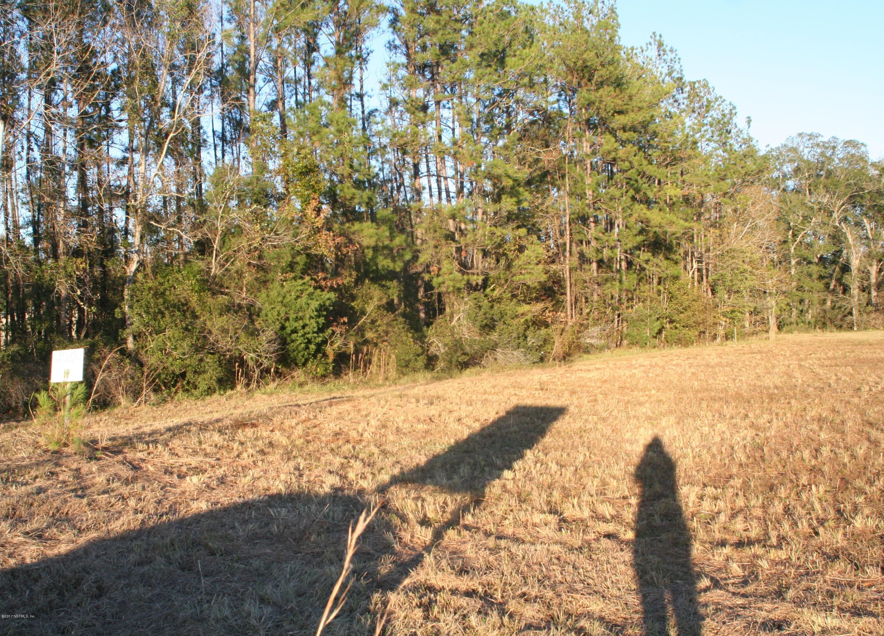542640 Highway 1 Callahan, FL 32011 - Photo 4 of 12 a view of a yard with wooden fence