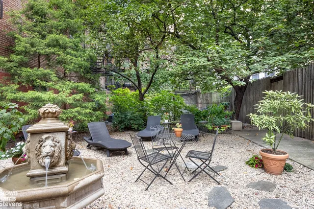 a bathroom with a granite countertop sink a toilet and a bathtub