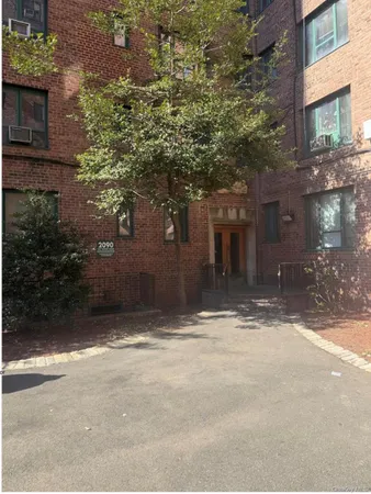 a view of a house with a tree