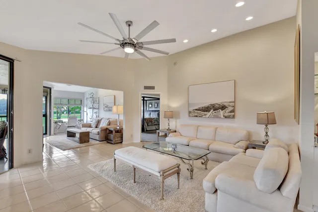 a bed room with a bed and a large window