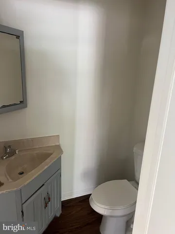 a bathroom with a sink a toilet and mirror