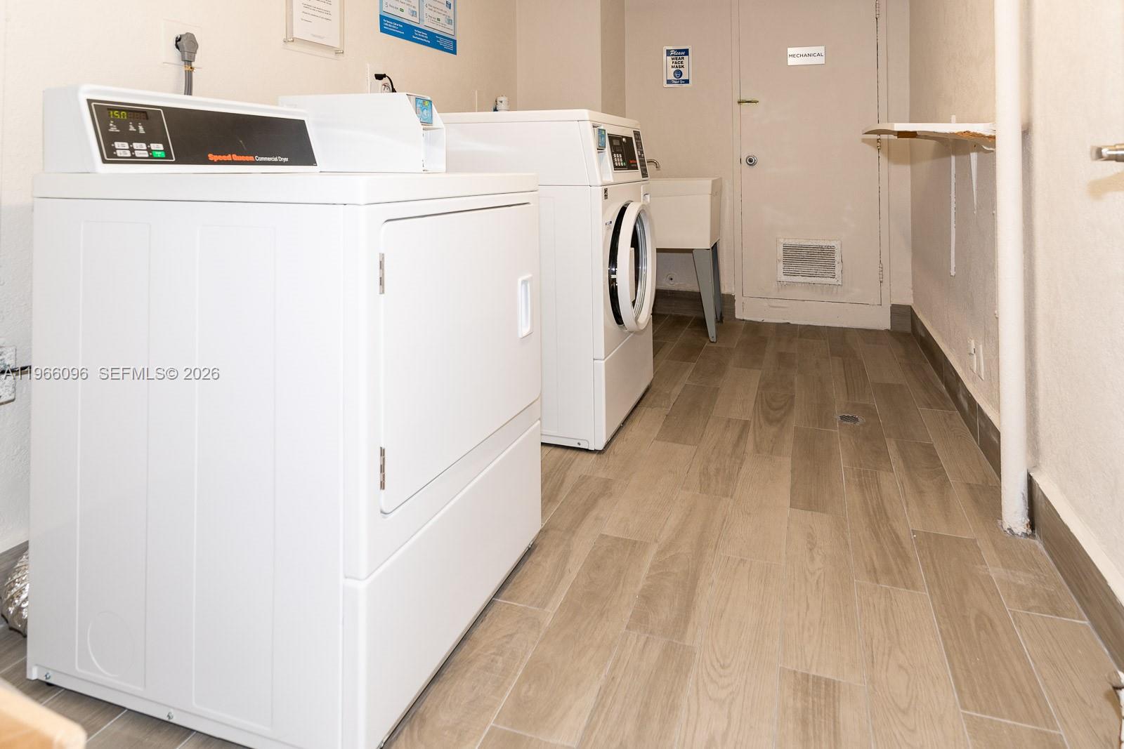 9225 Collins Avenue, Unit 609 Surfside, FL 33154 - Photo 17 of 27 a utility room with dryer and washer