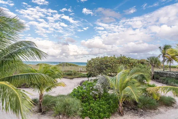 a living room with lots of furniture and a book shelf