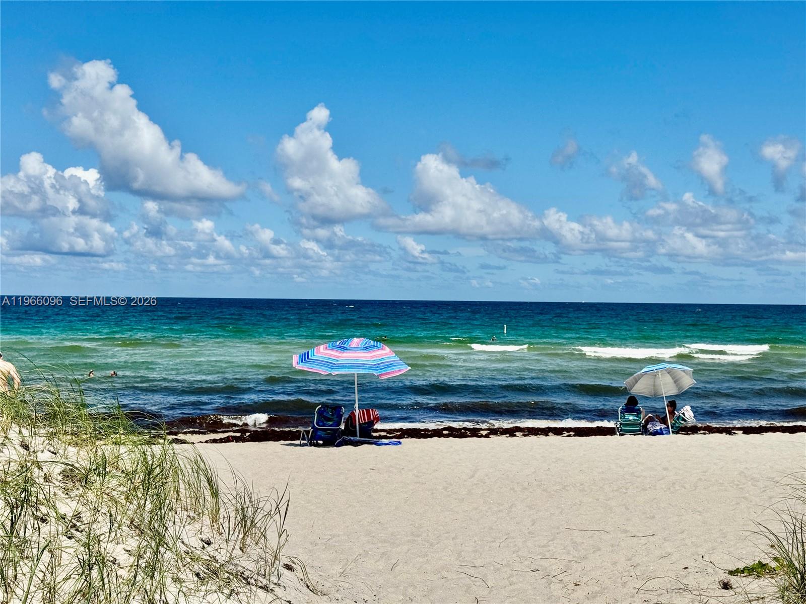 9225 Collins Avenue, Unit 609 Surfside, FL 33154 - Photo 2 of 27 a view of a house with a yard