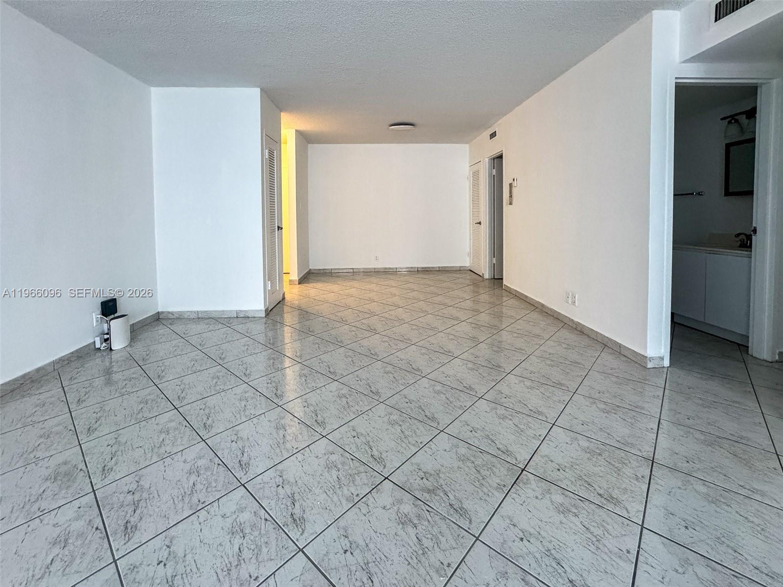 9225 Collins Avenue, Unit 609 Surfside, FL 33154 - Photo 9 of 27 a view of an empty room and window