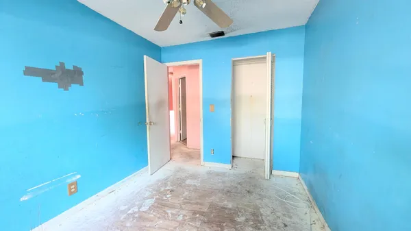 a view of a hallway with closet