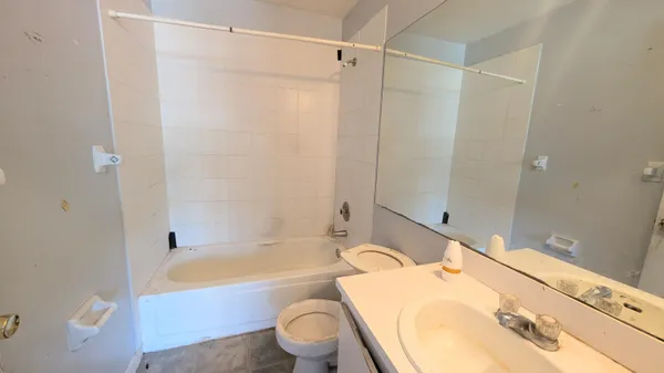 a bathroom with a sink toilet bathtub and shower