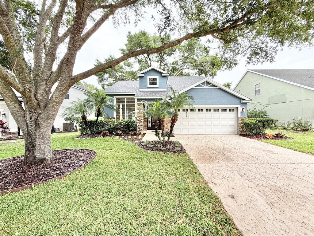 a view of a house with a yard
