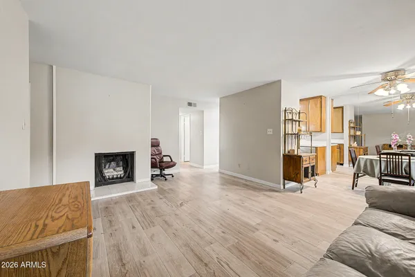 a view of a livingroom with furniture and a fireplace